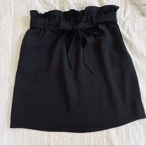 High-waisted sash tie mid thigh skirt in black.